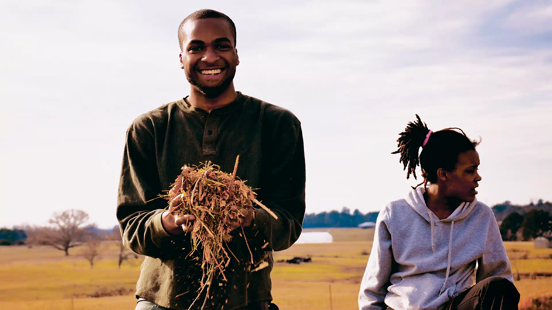 Tuskegee students working together in an agricultural field